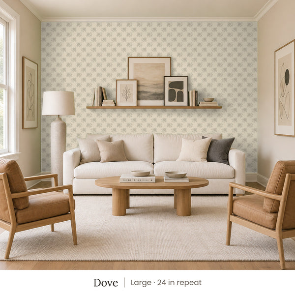 Tamsin Dove peel and stick wallpaper, large 24 in repeat, in a family room with a cream sofa and tan leather armchairs
