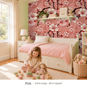 Sakura Pink peel and stick wallpaper, extra large 48 in repeat, in a girl's bedroom with a white daybed and a pink quilt