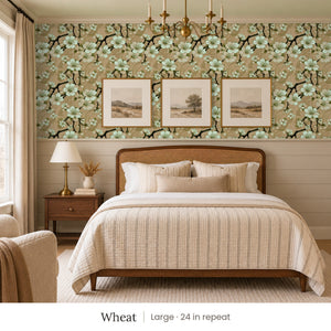 Sakura Wheat peel and stick wallpaper, large 24 in repeat, in a bedroom with shiplap paneling and framed landscape prints
