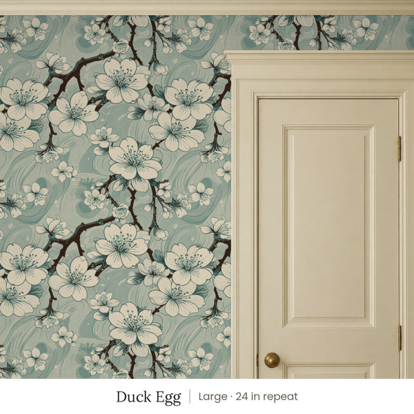 Sakura Duck Egg peel and stick wallpaper, large 24 in repeat, beside a cream panel door
