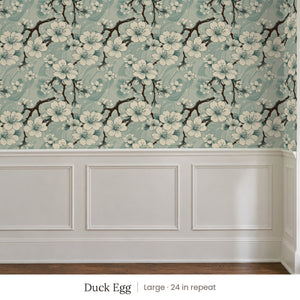 Sakura Duck Egg peel and stick wallpaper, large 24 in repeat, above white panel wainscoting