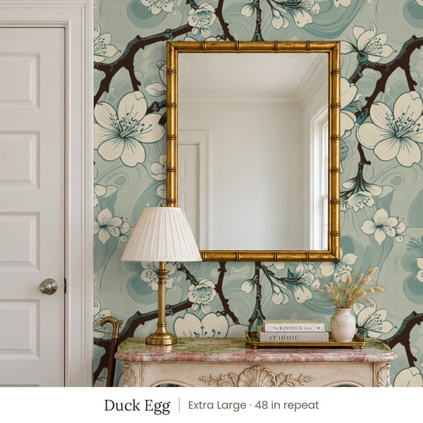 Sakura Duck Egg peel and stick wallpaper, extra large 48 in repeat, in an entry with a gold mirror and a carved console